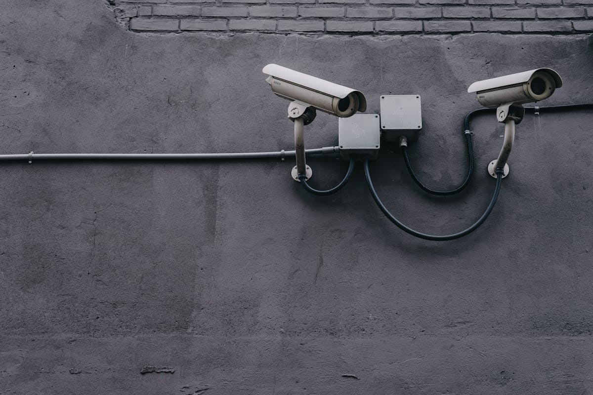 AI-powered surveillance camera in correctional facility - the deployment of automated monitoring in jails raises concerns about bias and accountability