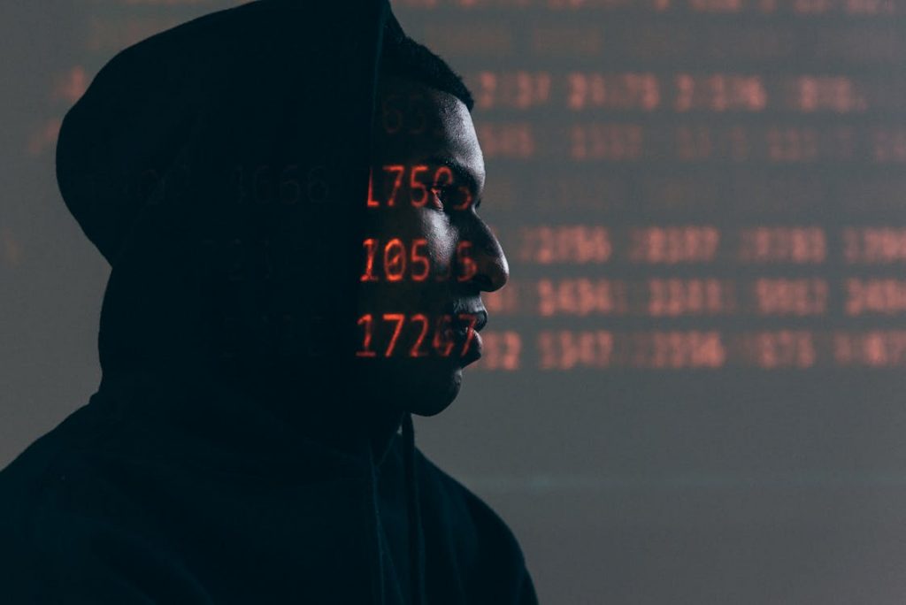 Digital face scan with projected data patterns illustrating biometric facial recognition technology used in smartphone monitoring apps