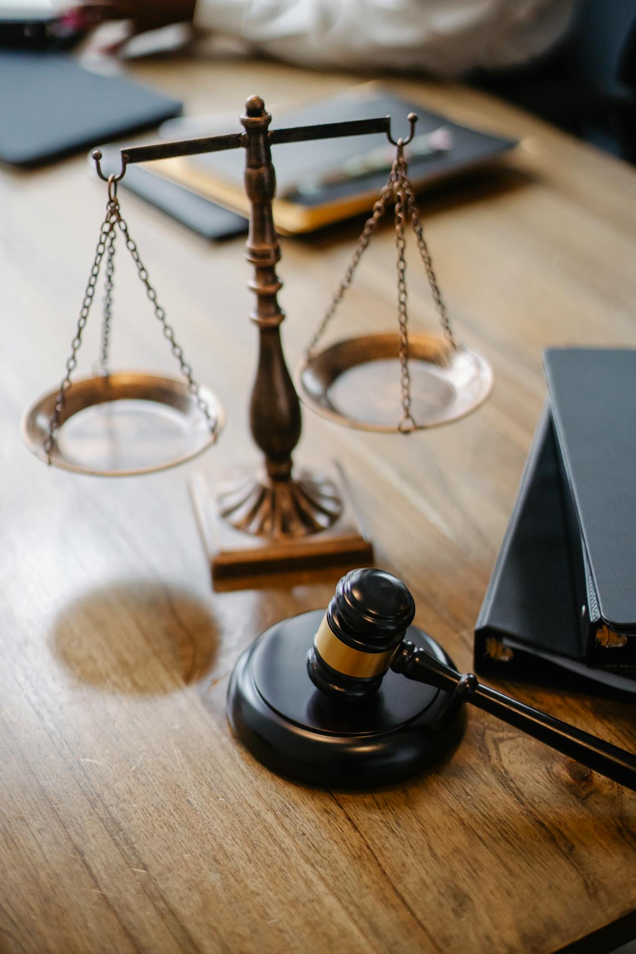 Court gavel and scales of justice representing domestic violence protection order GPS monitoring mandates