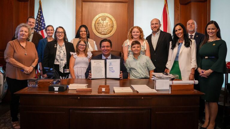 Florida Gov DeSantis signs HB 277 domestic violence reform bill into law May 21 2026 with survivors and Rep Debra Tendrich