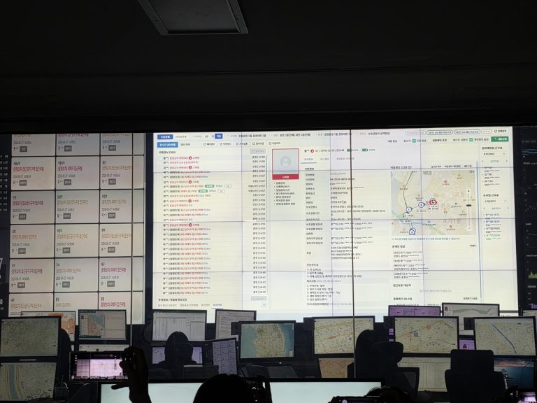 Probation officers at South Korea Ministry of Justice Central Location Tracking Control Center monitoring electronic ankle monitor locations in Seoul