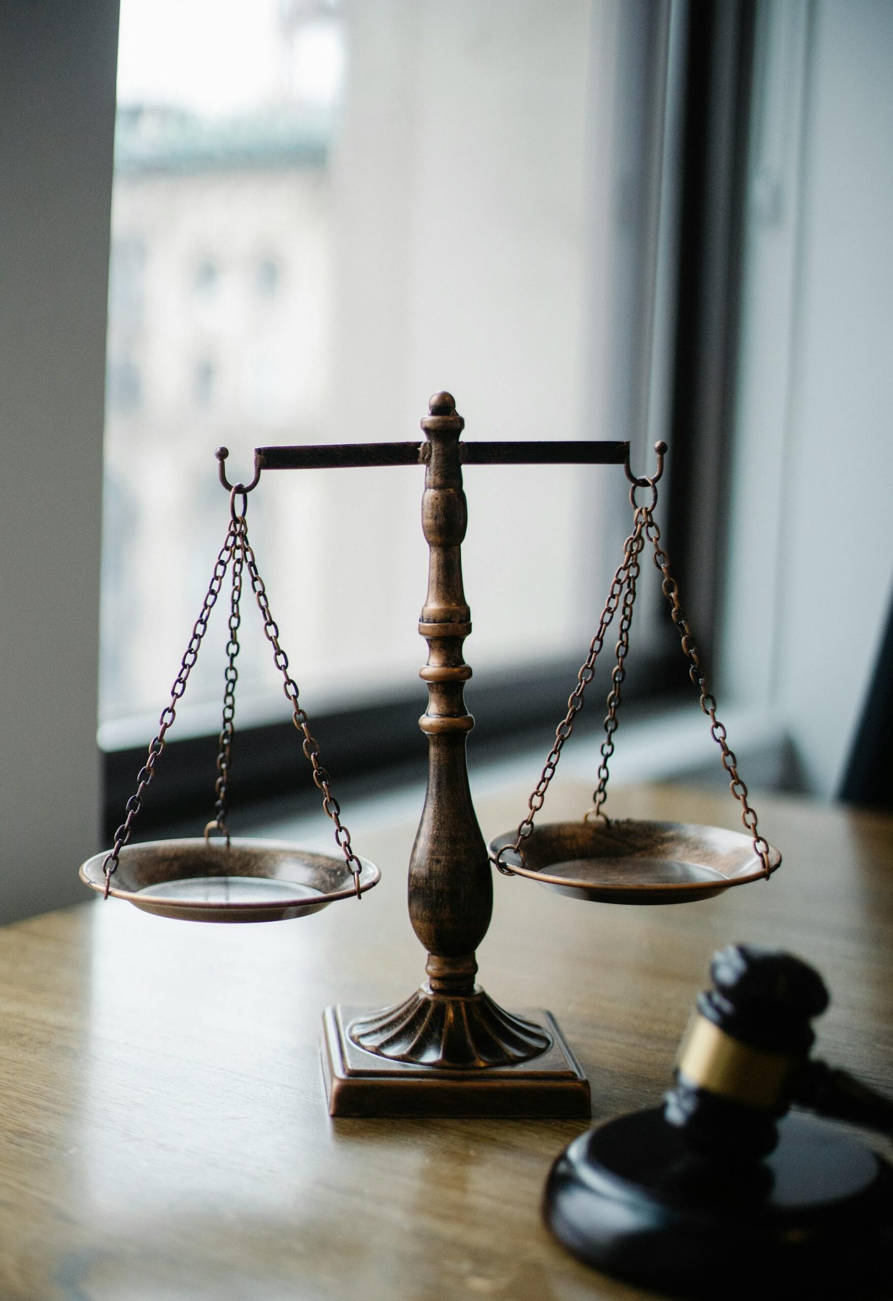 Judge gavel on legal documents - Texas courts struggle with GPS monitoring enforcement for murder suspects on bond