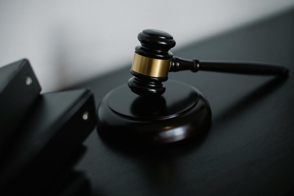Justice scales and law books - Texas murder suspects repeatedly flee after cutting GPS ankle monitors while on bond in 2024-2026
