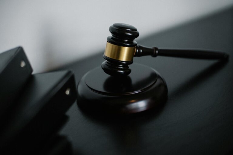 Justice scales and law books - Texas murder suspects repeatedly flee after cutting GPS ankle monitors while on bond in 2024-2026