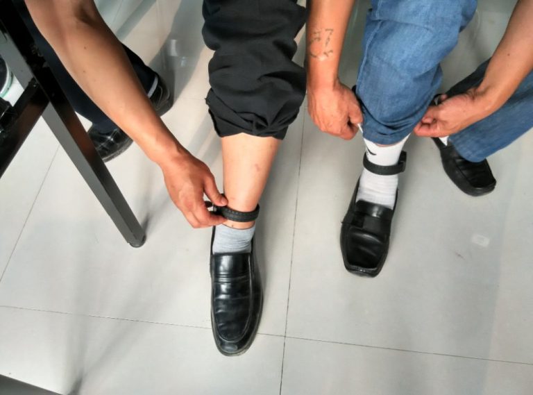 CO-EYE GPS ankle monitor being installed on community corrections enrollee at Bengbu Huaishang District