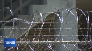 Scotland County Detention Center barbed wire fence - jail overcrowding crisis with 187 inmates in 109-bed facility. Source: Spectrum News 1