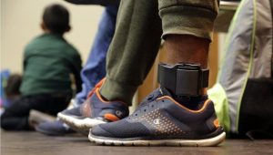 GPS ankle bracelet worn on ankle — electronic monitoring device used in pretrial supervision