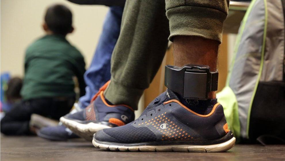 GPS ankle bracelet worn on ankle — electronic monitoring device used in pretrial supervision